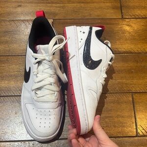 White and Black Sneakers with Red Accents